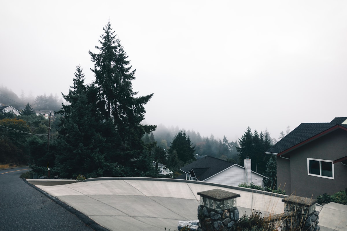 Concrete being poured at a residential construction site, illustrating the rising energy and material costs hitting homebuilding budgets in spring 2026.