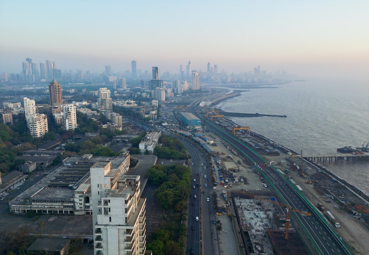 Aerial view of urban road construction, representing the federally funded safety infrastructure projects opening up under the 2026 Safe Streets grant program.