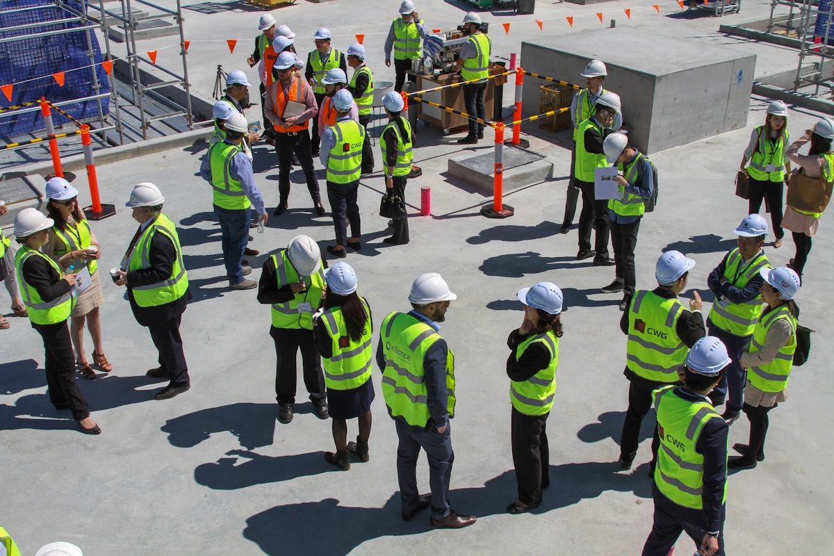 A general contractor and owner meeting during preconstruction to review project scope and schedule commitments.