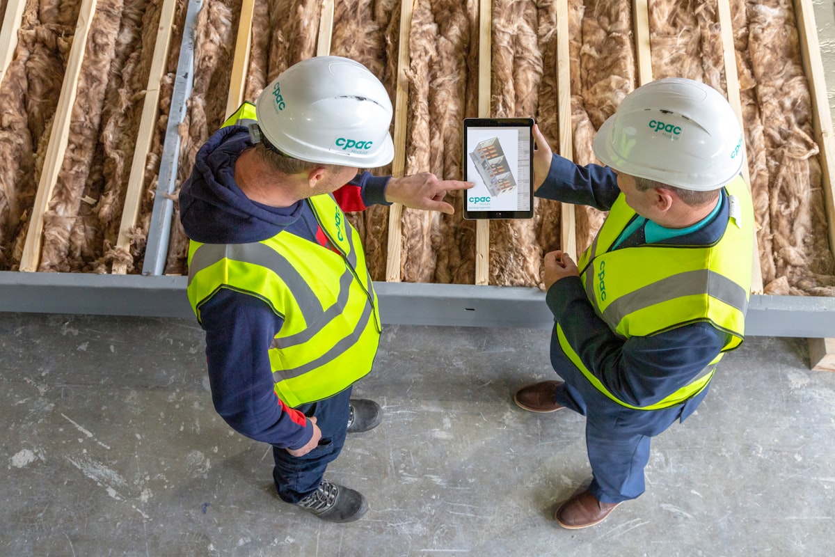 A GC estimating team reviewing a new bid management platform during a preconstruction workflow session.
