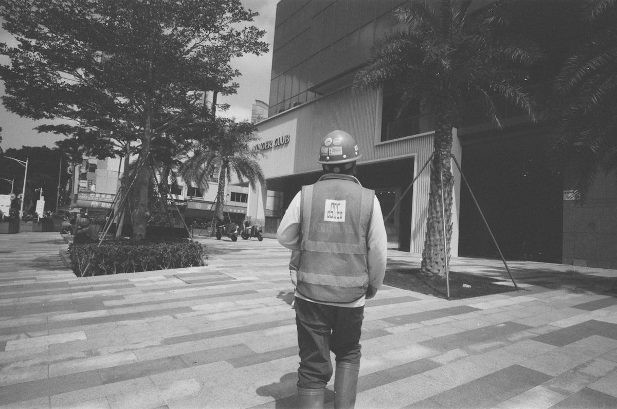 Construction safety officer reviewing compliance requirements on an active jobsite.