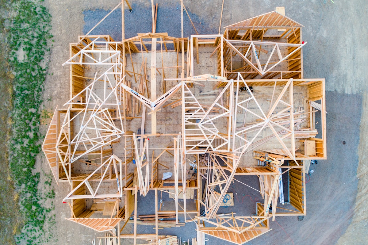 Wood framing of a single-family home under construction, representing the April 2026 decline in housing starts.
