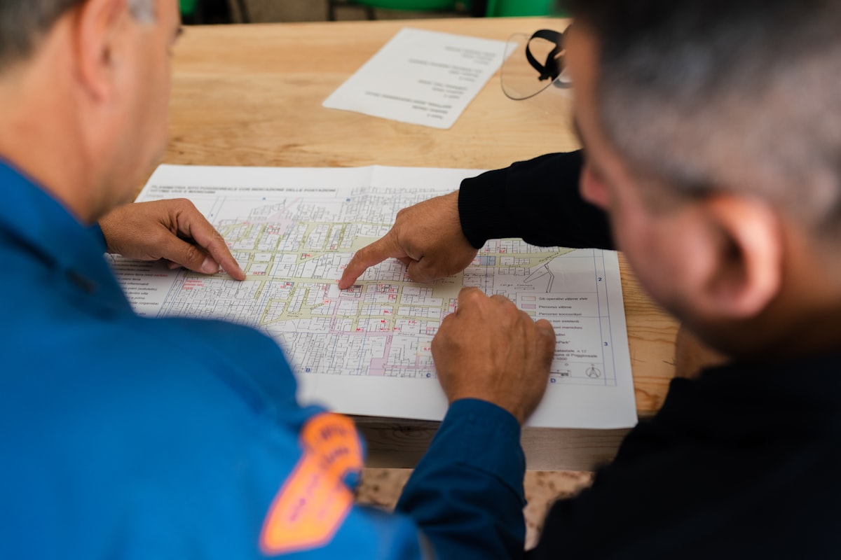 A GC preconstruction team reviewing a project budget and draw schedule with a developer before construction begins.