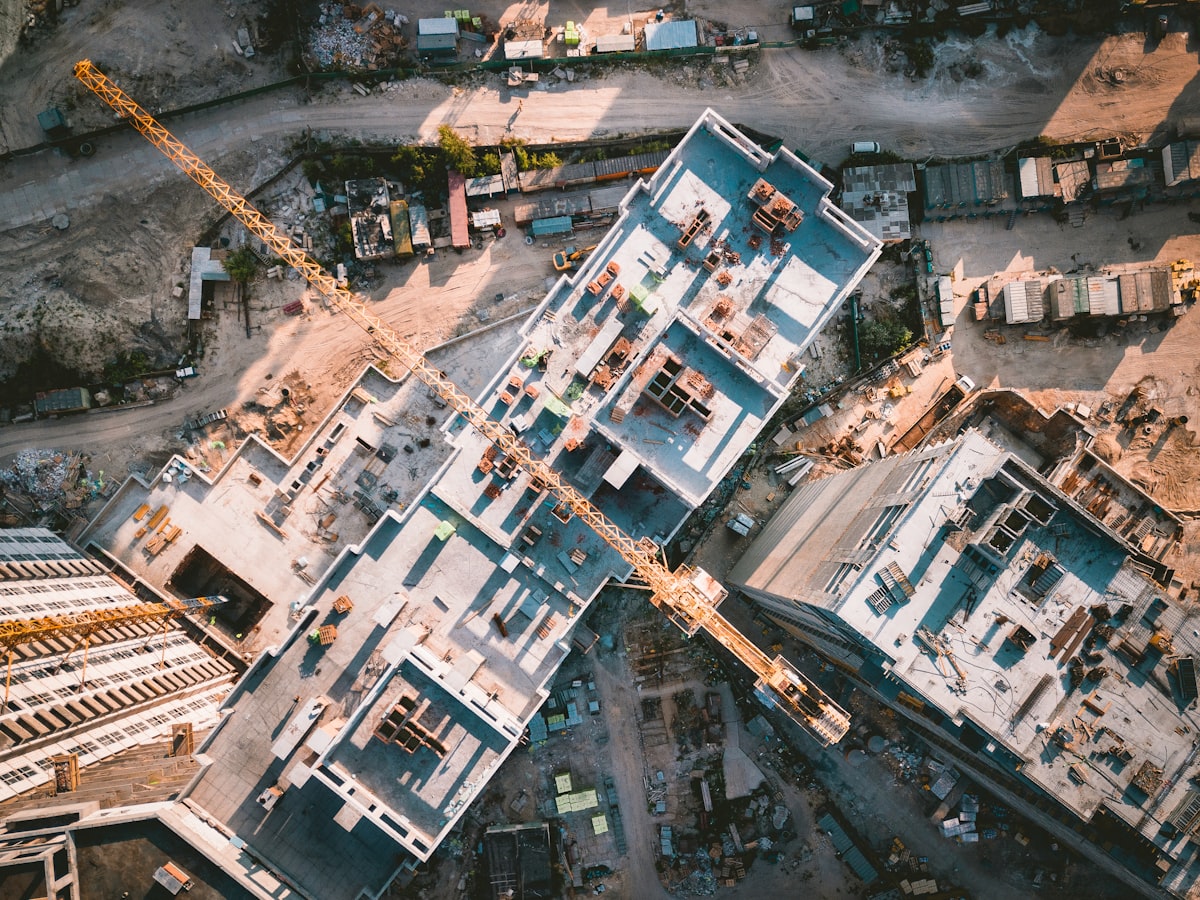 Aerial view of public infrastructure construction, reflecting the public sector spending gains driving nonresidential market activity in April 2026.