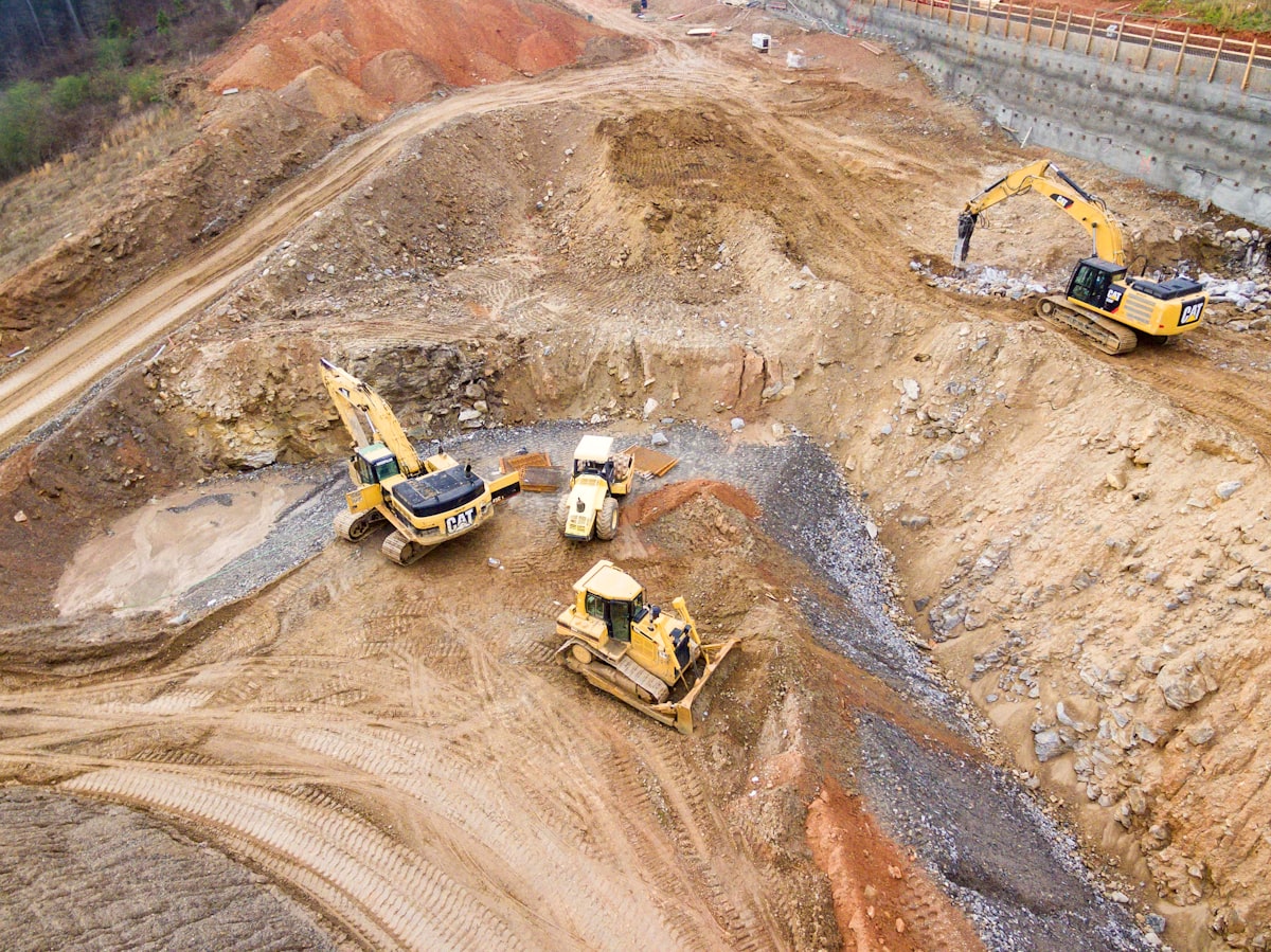 Heavy equipment on a construction site, representing the shift toward remote operation and autonomous machinery in the field.