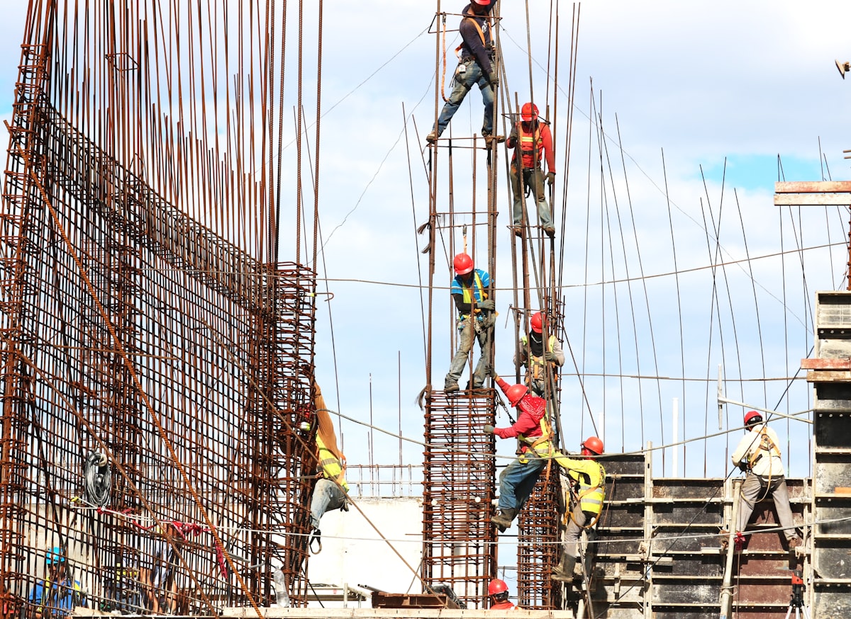 Construction crew on a concrete pour, representing the craft labor workforce driving 5% annual wage gains in May 2026.